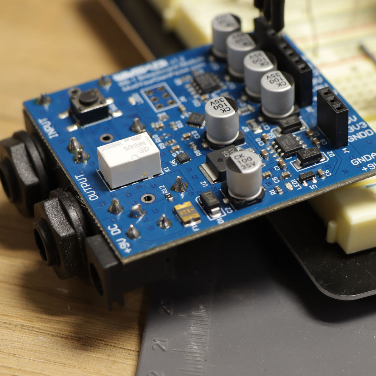 Close-up of the BB-1 breadboard module showing the input and output jacks, relay true bypass and on/off button